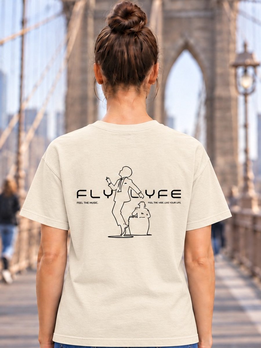 The Conga Tee in the women's relaxed cut, worn on the Brooklyn Bridge — FLYLYFE