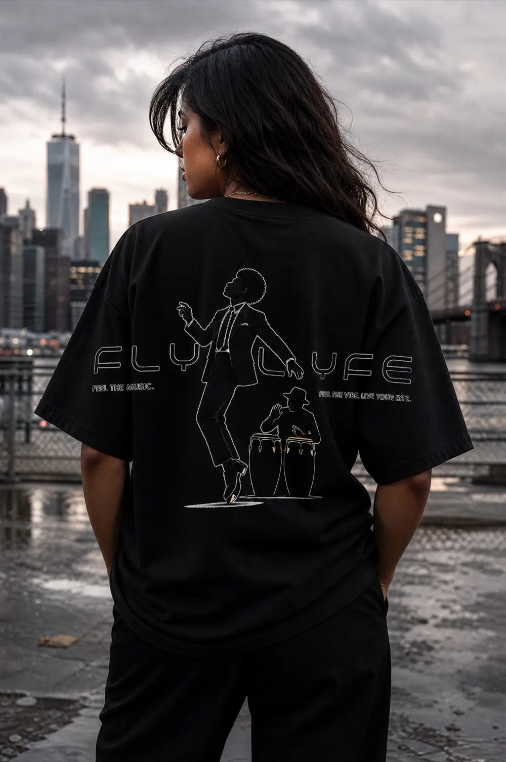 FLYLYFE women's Dancer & Conga tee, back design, worn by model Wren on the Brooklyn waterfront